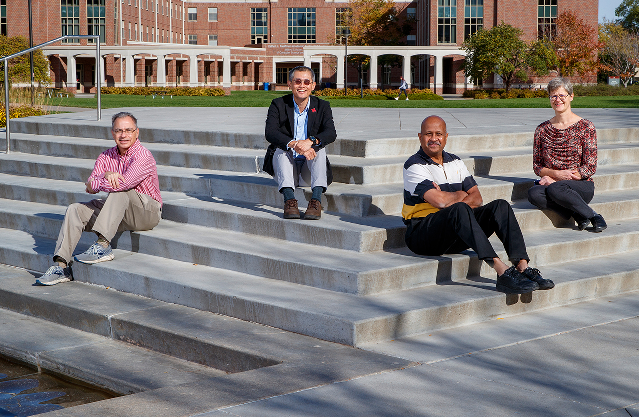 Mike Hayes, Leen-Kiat Soh, Ashok Samal and Regina Werum are members of a multidisciplinary research team that integrates computer science and the social sciences to develop a model that anticipates social unrest events. The photo is a composite of four individual photos, allowing the researchers to appear without their masks.