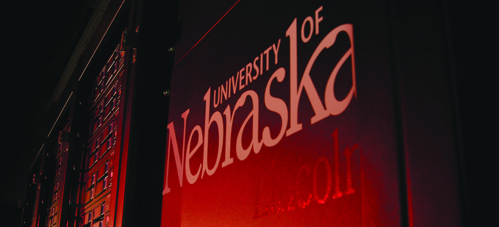 Students walk the campus of the University of Nebraska on a sunny day.