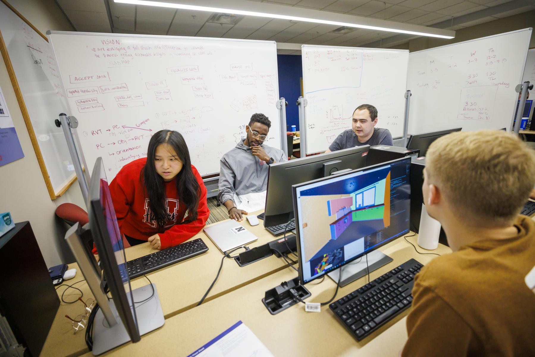 Engineering student looking up with virtual reality equipment.