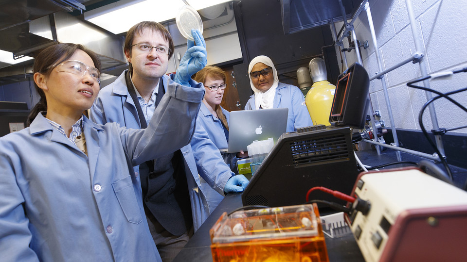 Max Pierobon with his students in the lab