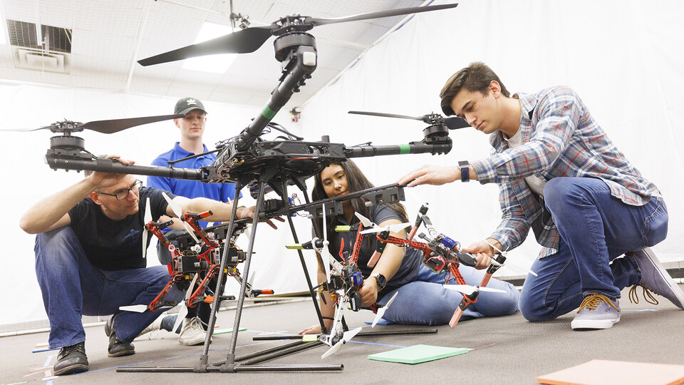 Huskers work on a drone swarm idea in a College of Engineering lab. The federal award will expand all levels of robotics instruction on campus.