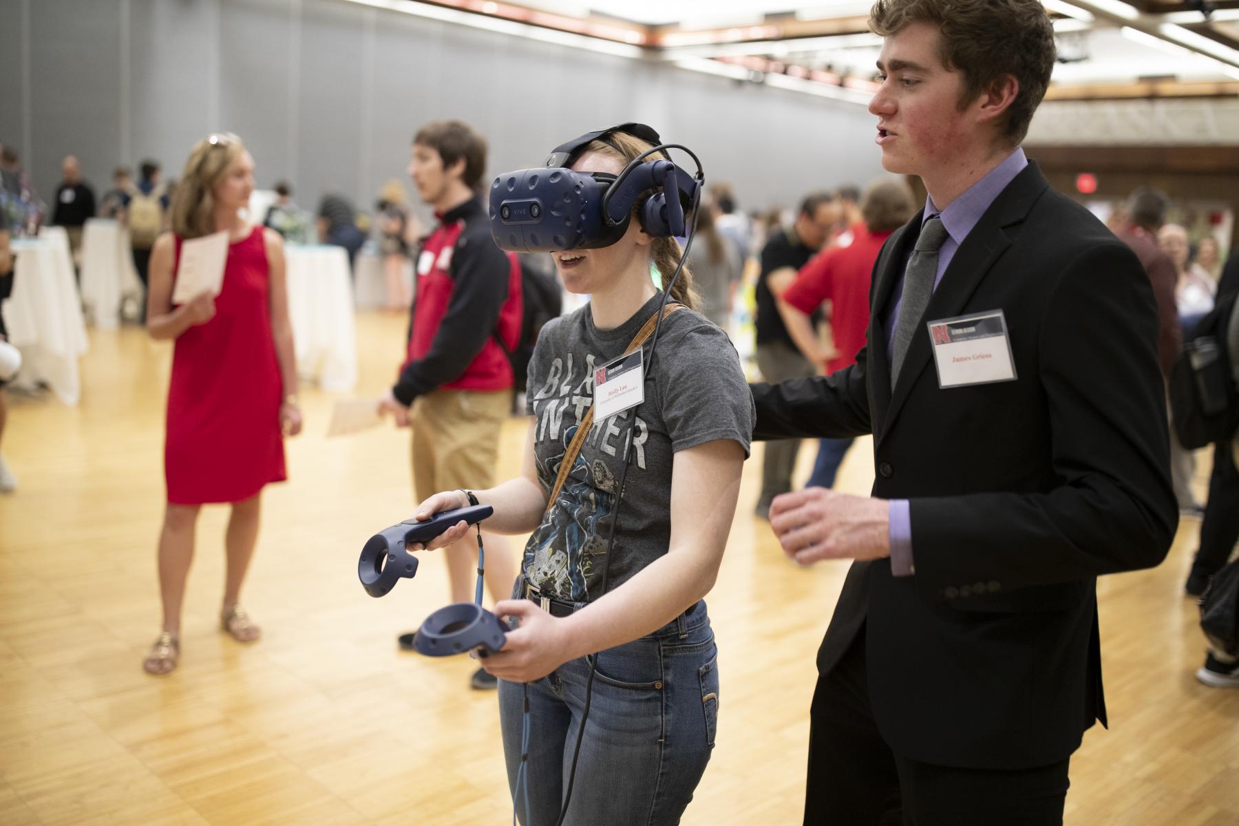 A student demos the augmented reality software created by a Senior Design team at this year's Senior Design Showcase event.
