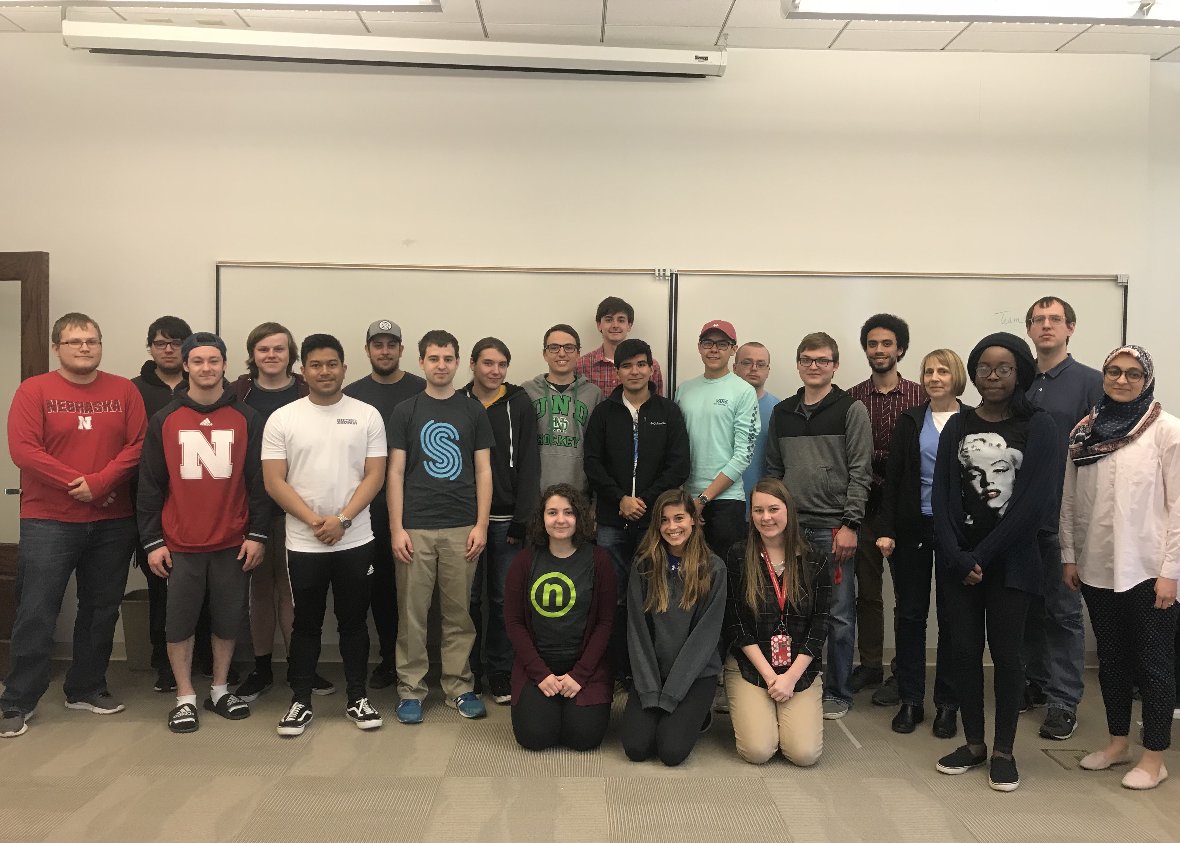 Students in the first software engineering cohort pose after their SOFT 261 class presentations.