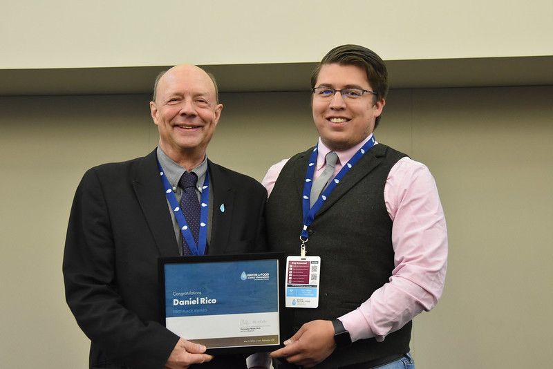 Daniel Rico accepts his first place award at the 2023 Water for Food Global Conference.