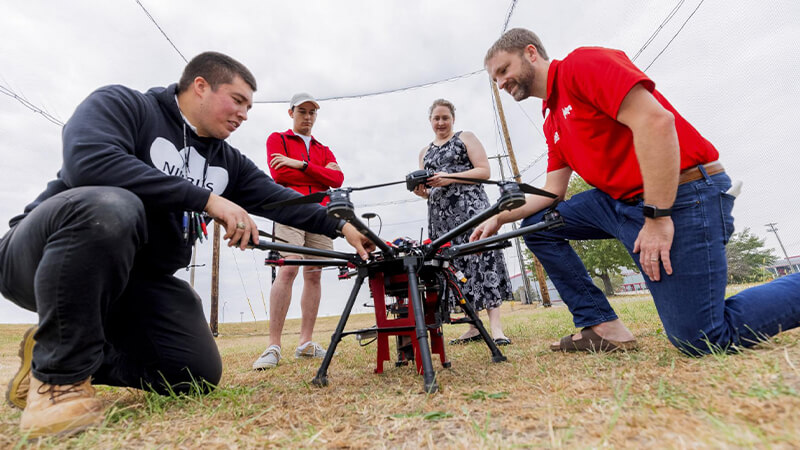 Students working on large drone