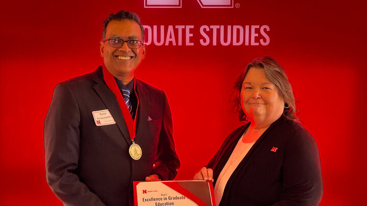 Byrav Ramamurthy accepting the Dean's Award for Excellence in Graduate Education.