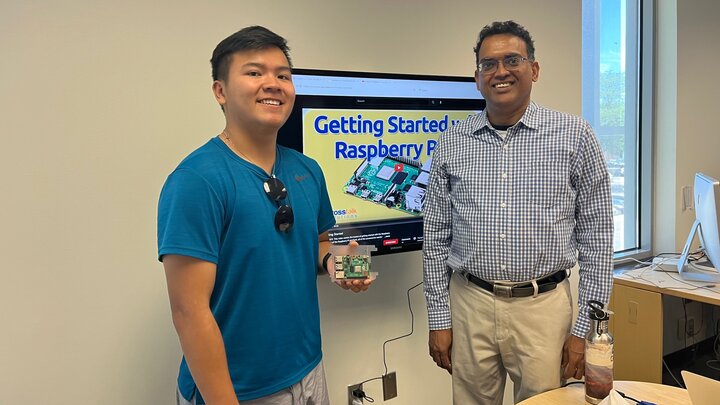 UBMS scholar Justin Nguyen and professor Byrav Ramamurthy display the Raspberry Pi hardware used in the group's summer project.