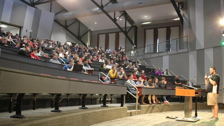 Students listen as tech companies pitch their organizations and available opportunities. (Photo by Fred Knapp, NET News)