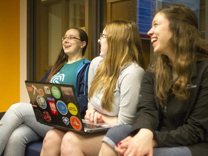 Students laughing in a meeting